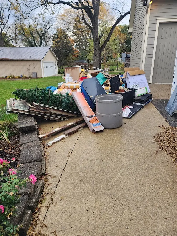 Dumpster being loaded with debris for 3 Yard Dumpster Rental in Carthage